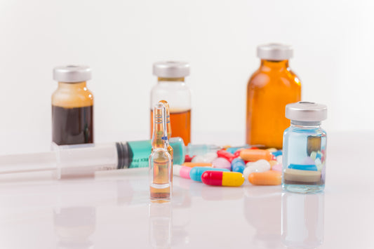 Image: A selection of prescription drugs shown on a white background.